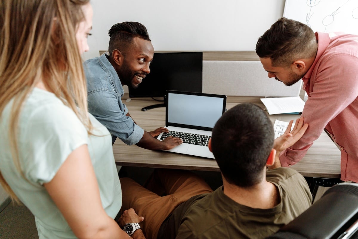 People around a computer